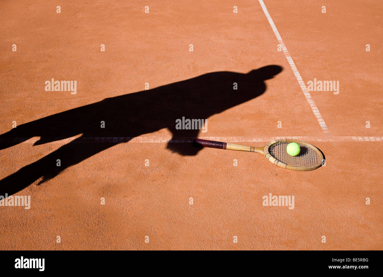 Shadow of a person playing tennis Stock Photo