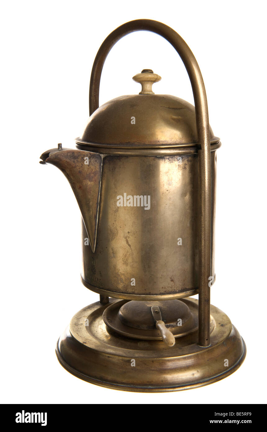 Old coffee machine made of brass, with tilting mechanism and spirit lamp Stock Photo
