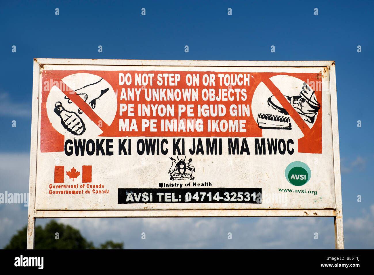 Sign warning of unexploded ordnance in a village in the Kitgum region of northern Uganda. Stock Photo