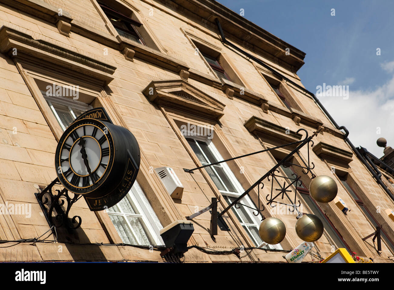 UK, England, Yorkshire, Keighley, East Parade, three brass balls hanging outside pawnbrokers shop Stock Photo