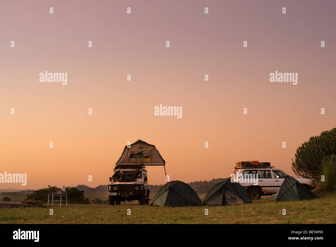 Tents and vehicles at a campsite in Kidepo Valley National Park in northern Uganda. Stock Photo