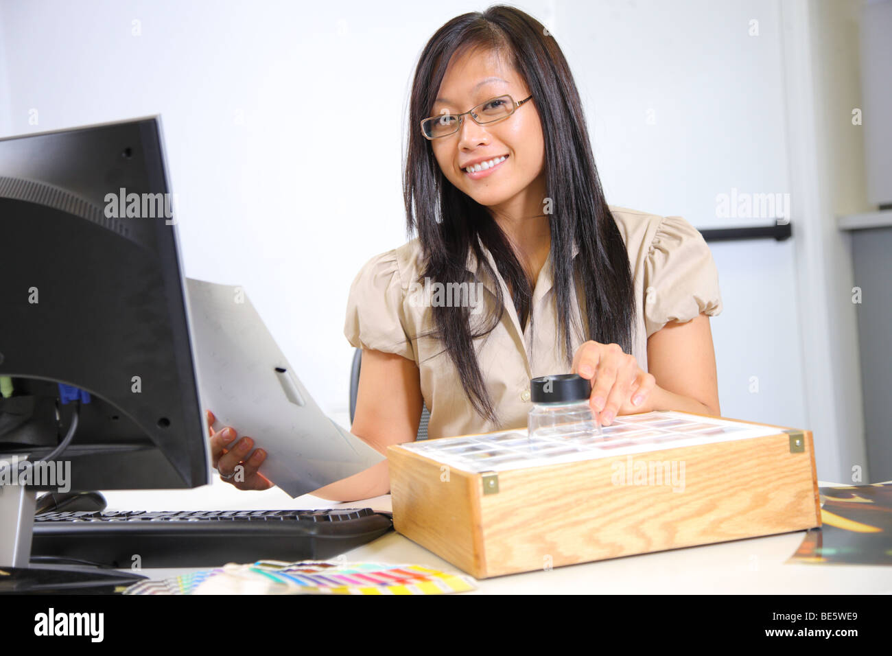 Creative businesswoman at desk Stock Photo