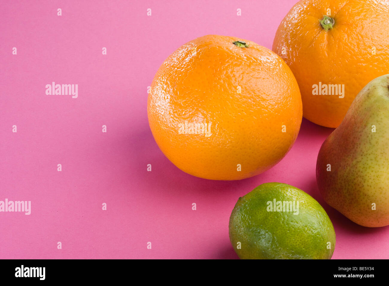 Oranges, pear, lime Stock Photo