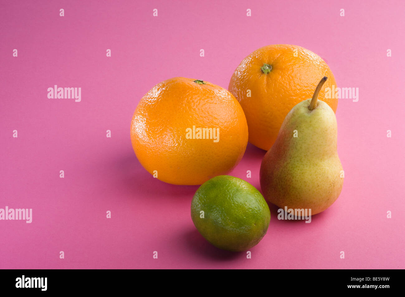 Oranges, pear, lime Stock Photo