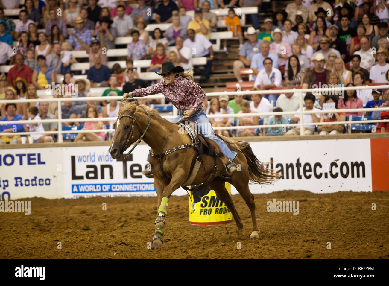 Rodeo cowgirl barrel racing at the Mesquite Championship Rodeo