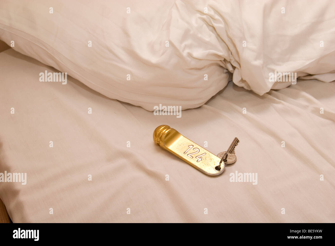 hotel bed with room keys Stock Photo Alamy