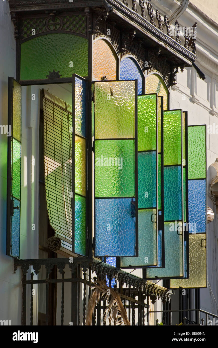 Open colorful glass windows on a typical oriel in Cordoba, Andalusia