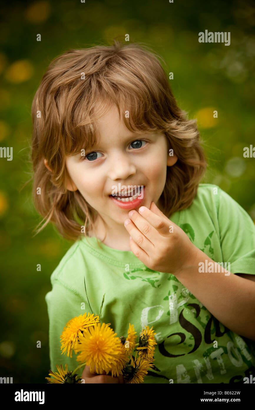 Boy, 3 years old, with dandelion Stock Photo