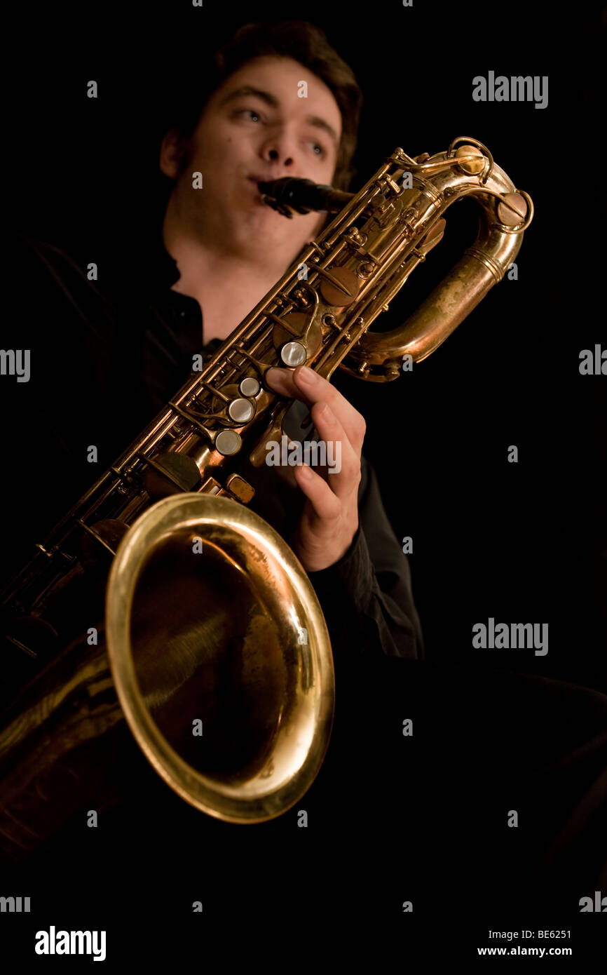 Young musician playing the baritone saxophone Stock Photo Alamy