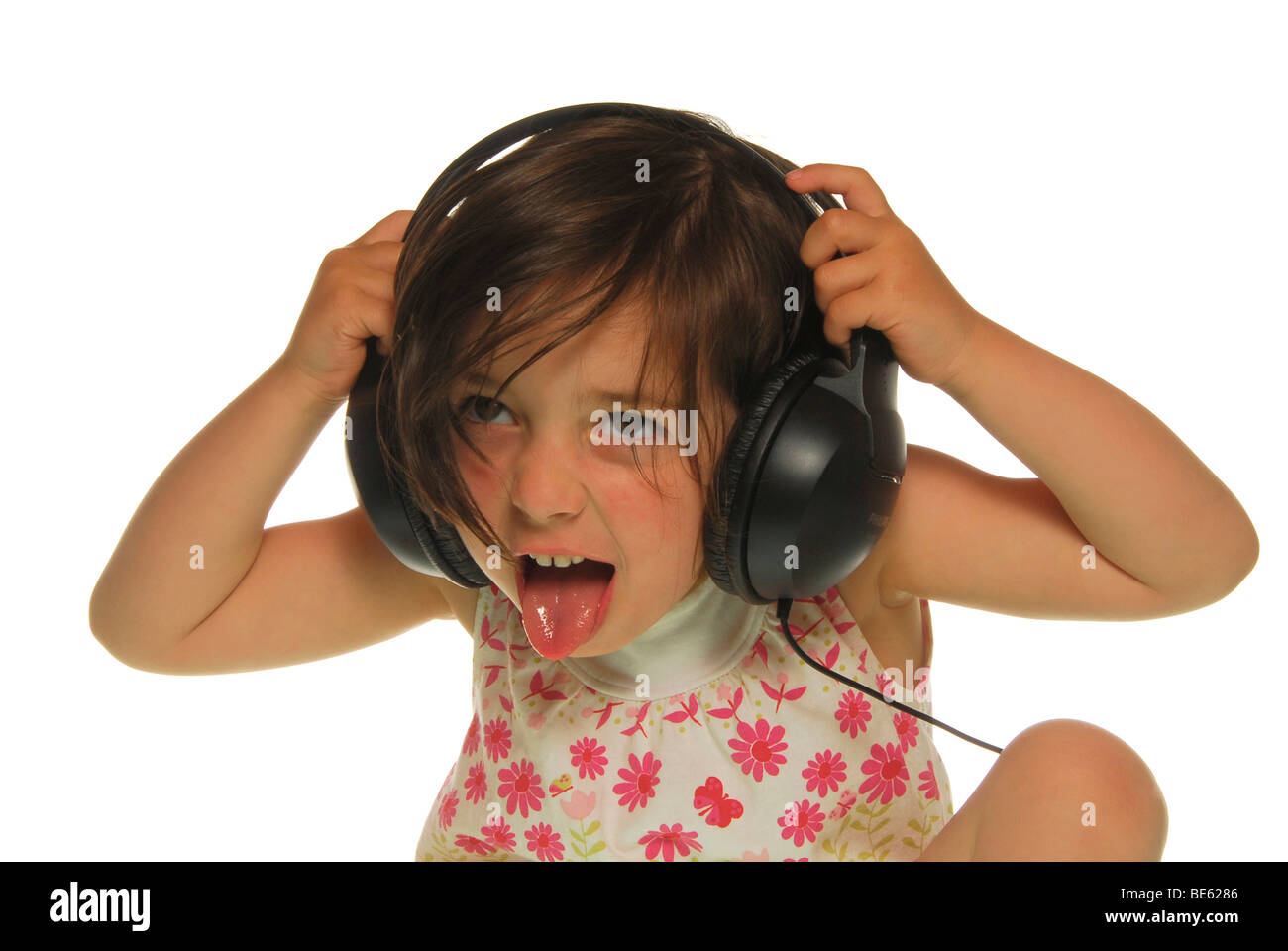 Fouryearold girl with headphones Stock Photo Alamy