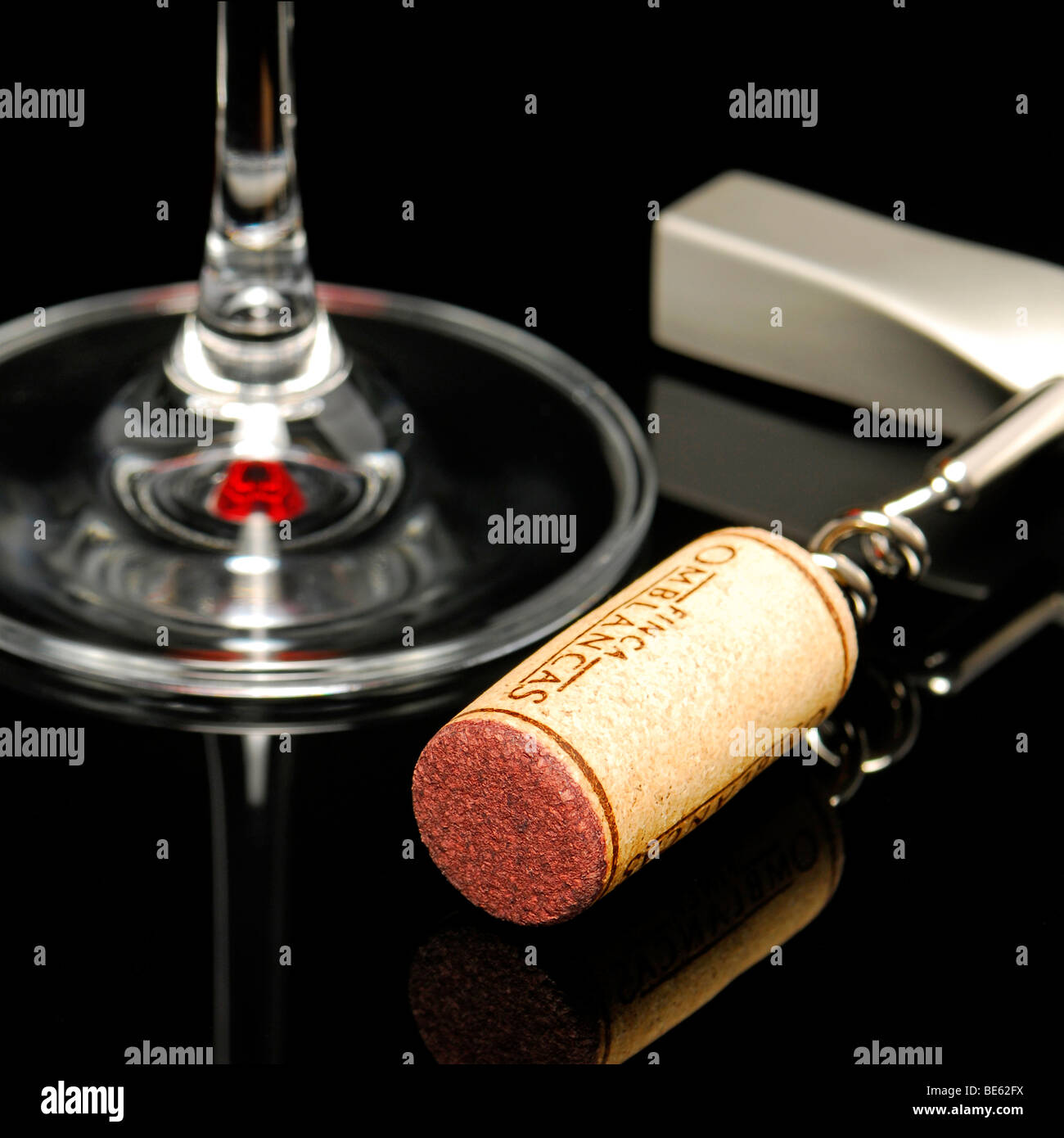 Still life, wine glass, corkscrew, on black Stock Photo