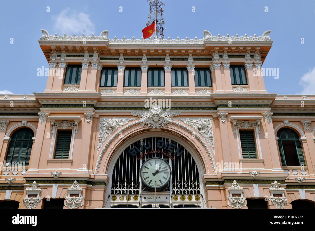 Building, clock above the entrance of the main post office, Ho Chi Minh City, Saigon, Vietnam, Southeast Asia Stock Photo