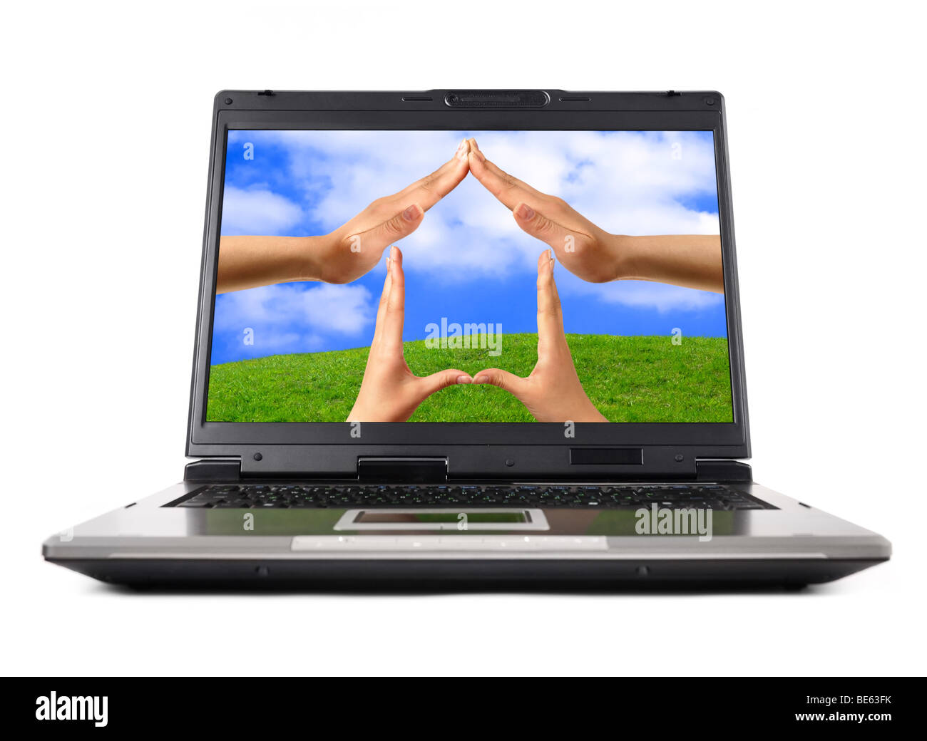 Conceptual Home symbol on a laptop computer display Real Estate Environmental technology concept Stock Photo