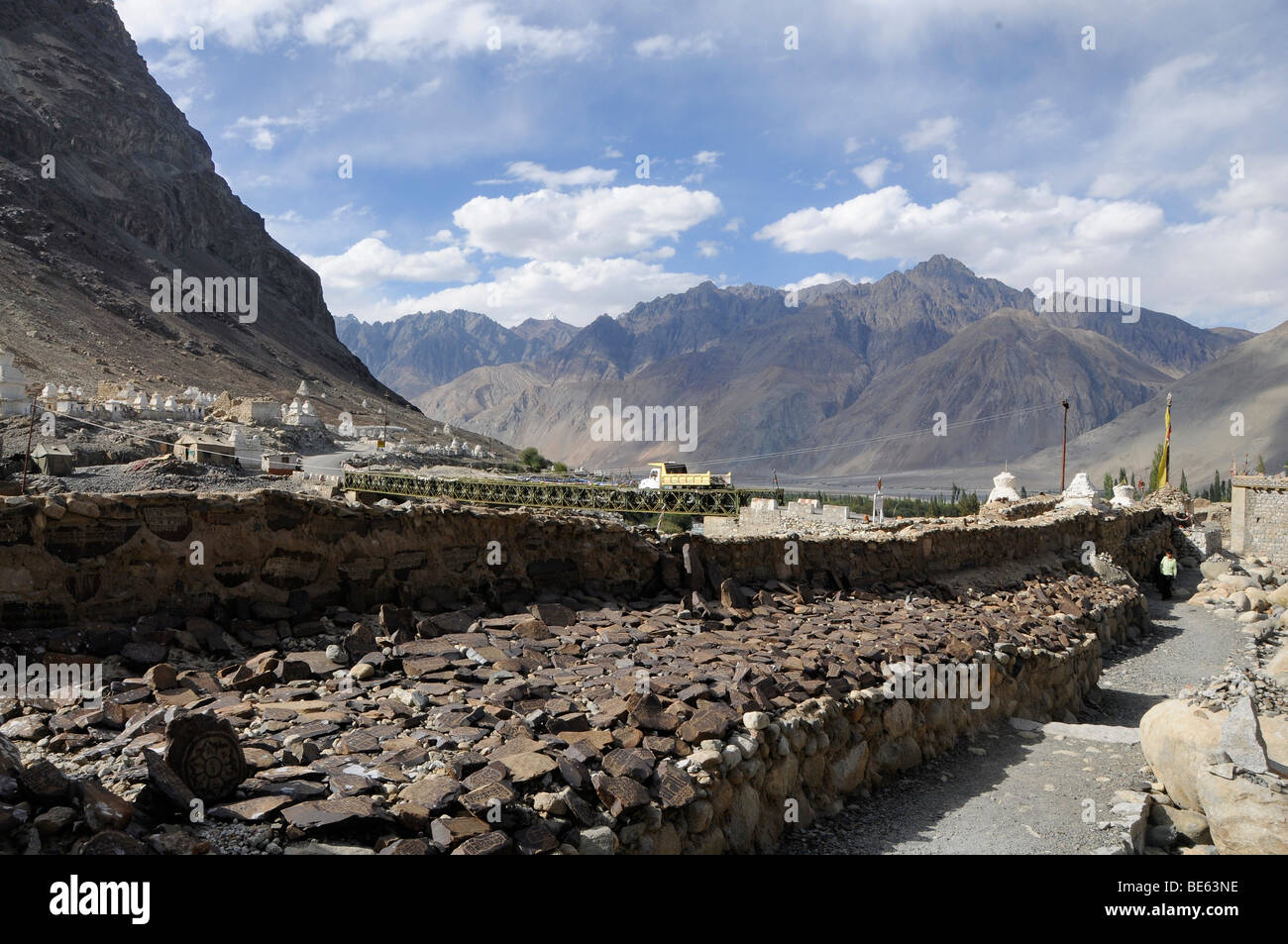 Mani (prayer inscribed) stones with Mantras on a Mani wall in the Hundar oasis, Nubra Valley, Ladakh, Jammu and Kashmir, North  Stock Photo