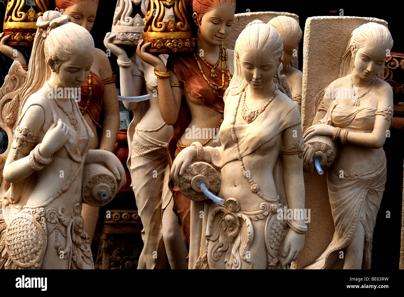 Stone carving of Buddhist Asian angels , women , garden statues