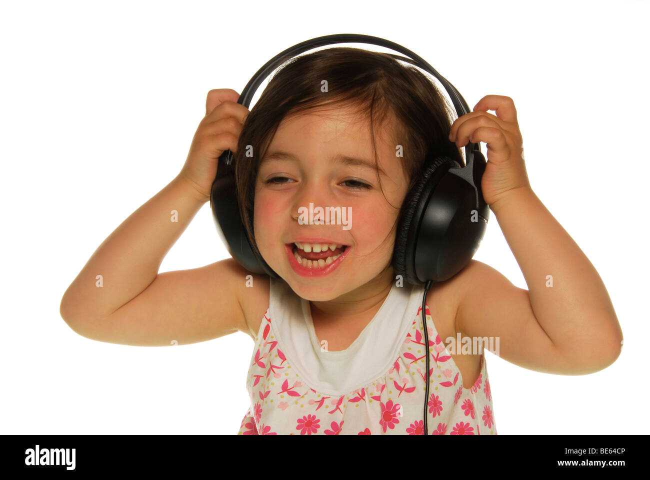 Fouryearold girl with headphones Stock Photo Alamy