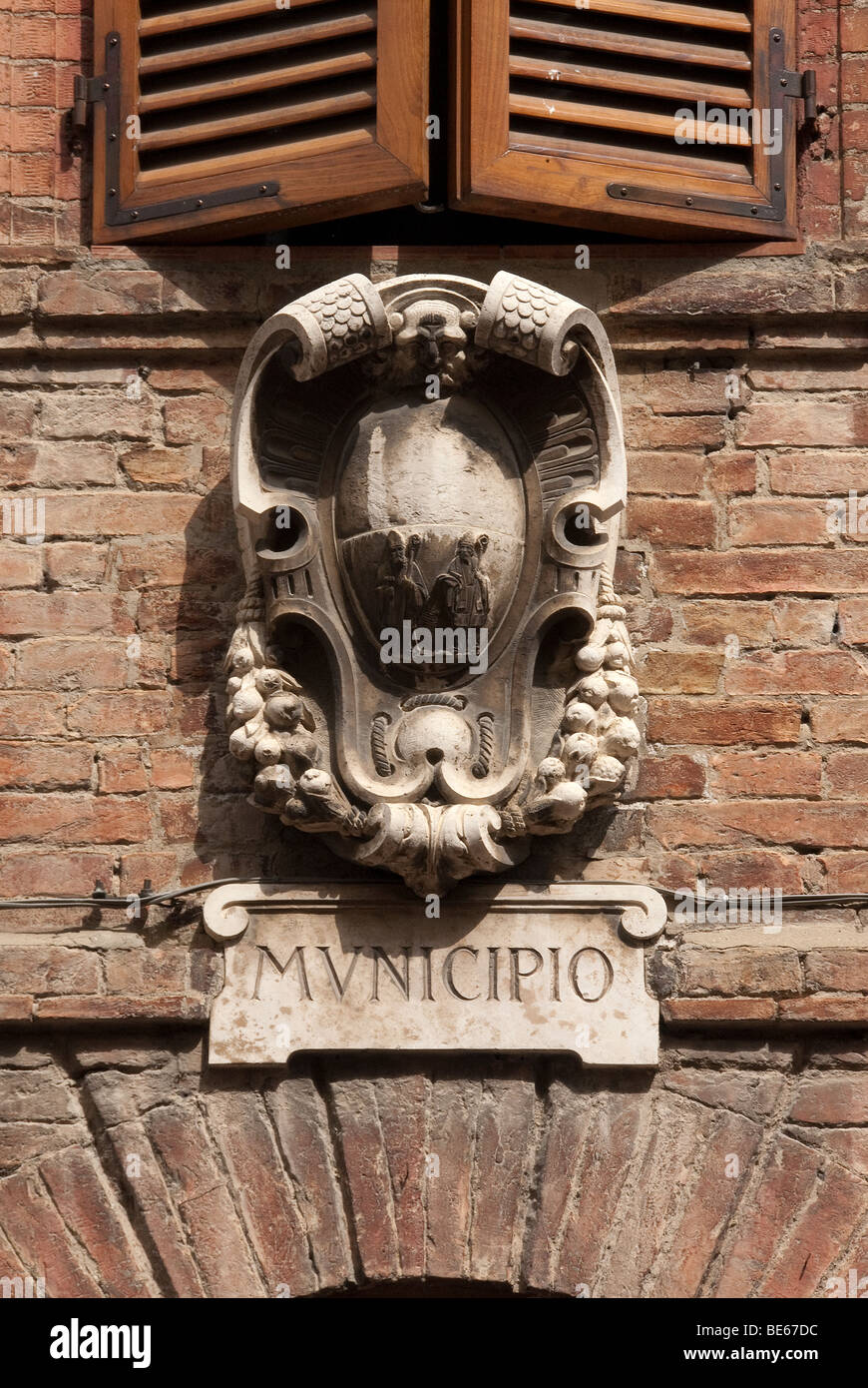 Municipal town hall stone carved shield in Tuscany Stock Photo