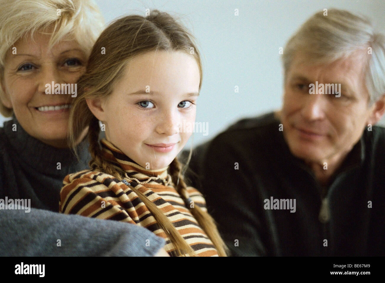 Young girl with grandparents, portrait Stock Photo