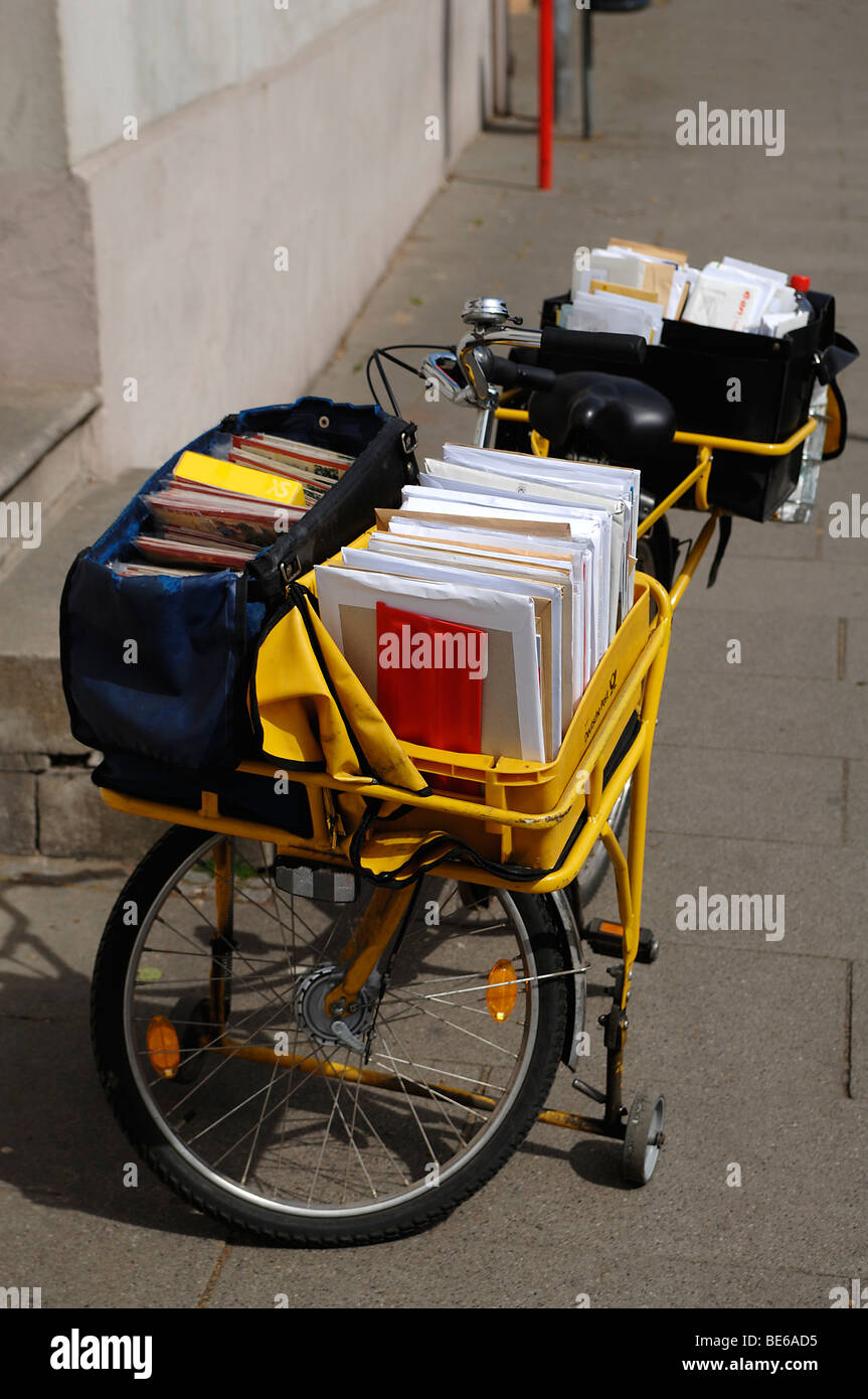 Full mail bicycle of a postman, Lueneburg, Lower Saxony, Germany, Europe Stock Photo