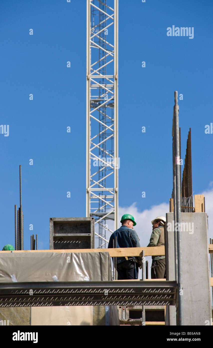 Construction workers on a large construction site in Berlin, Germany