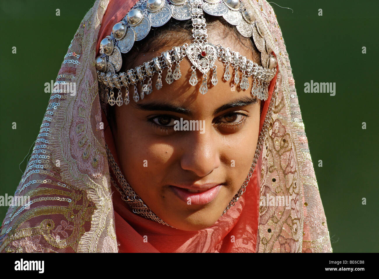 Omani girl in traditional dress with jewelry, Nakhl, Batinah Region, Sultanate of Oman, Arabia, Middle East Stock Photo