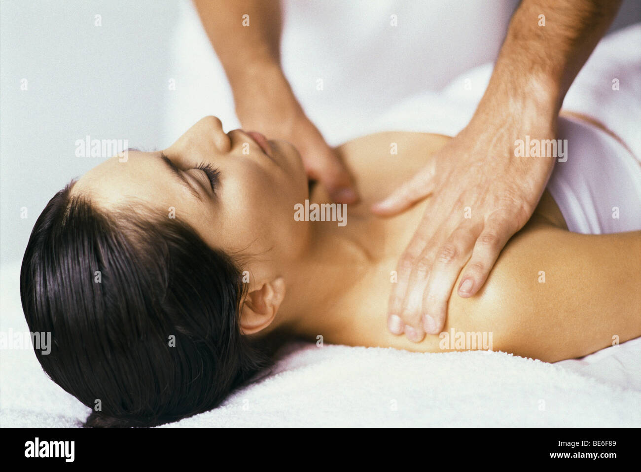 Woman enjoying massage Stock Photo