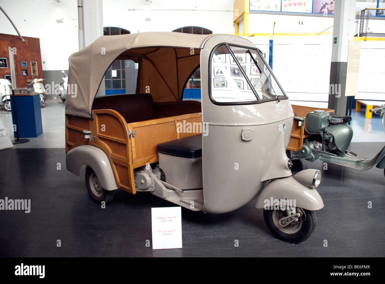 Three wheeled taxi truck called an Ape, in the Piaggio Museum Giovanni Alberto Agnelli, near Pisa, Italy Stock Photo