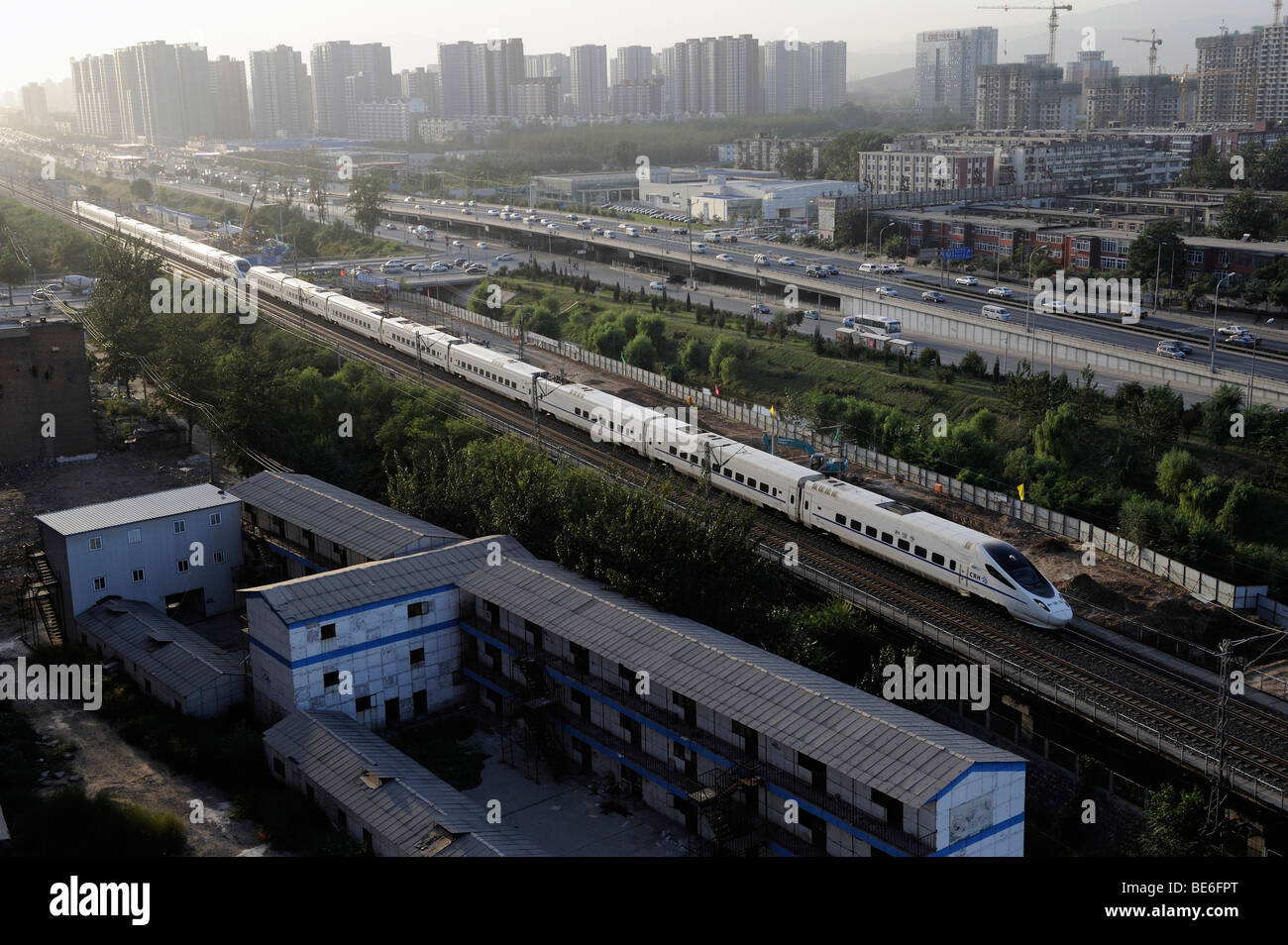 A CRH, China Railway Highspeed bullet train through Beijing city. 09