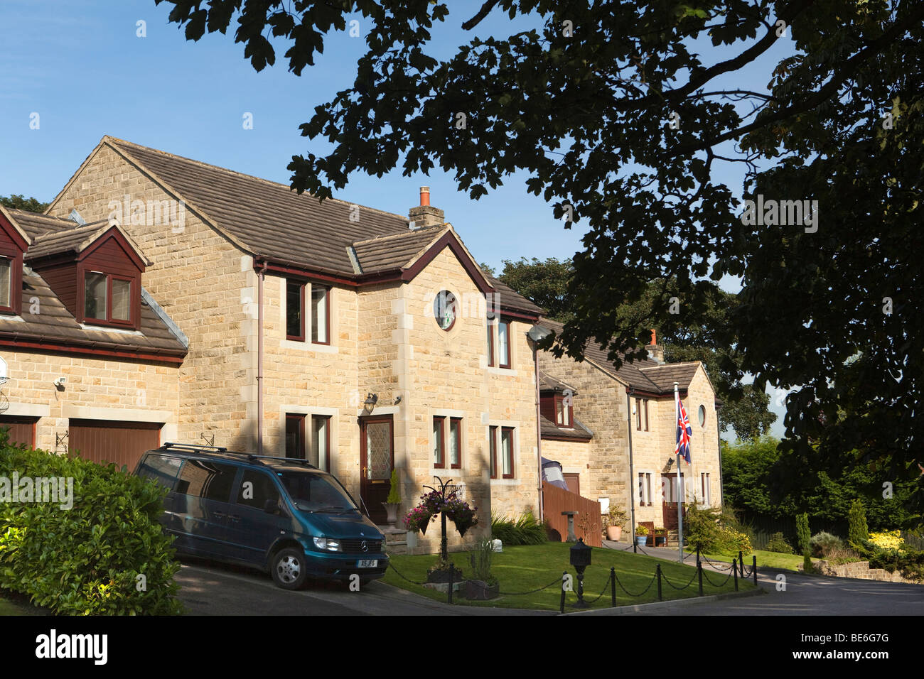 UK, England, Yorkshire, Haworth, new build houses constructed in local stone Stock Photo