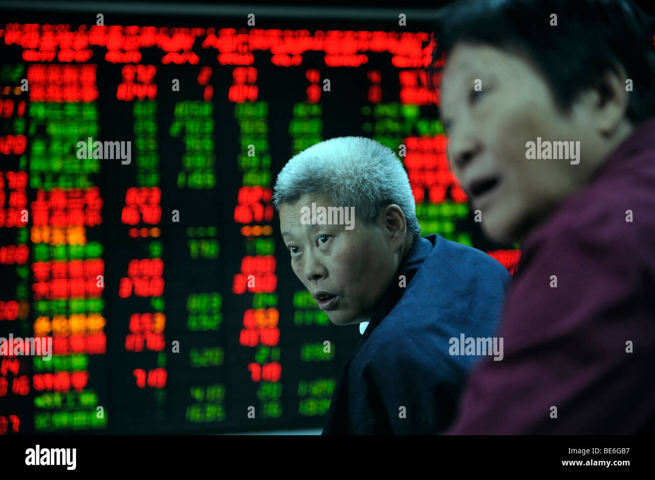 Investor look at stock index quotes at a securities firm in Beijing, China. 21-Sep-2009 Stock Photo