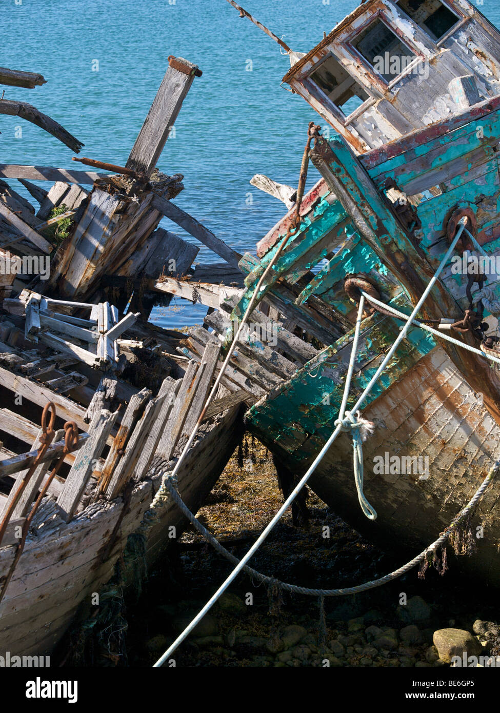 Fishing boat shipwrecks on the shore in the port of Camaret Sur Mer, Brittany, France Stock Photo