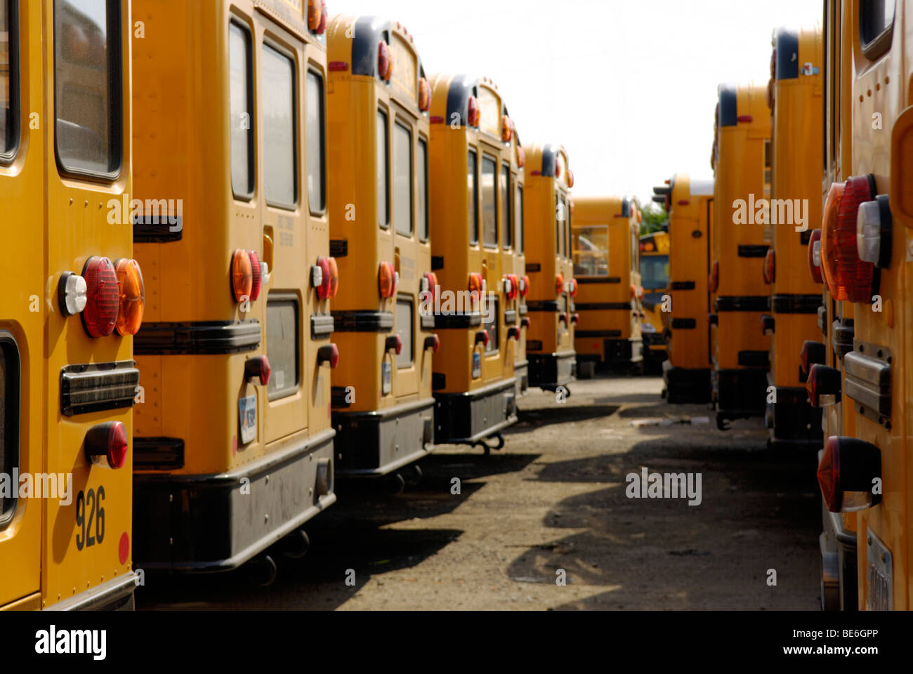 School buses parked in a depot Stock Photo
