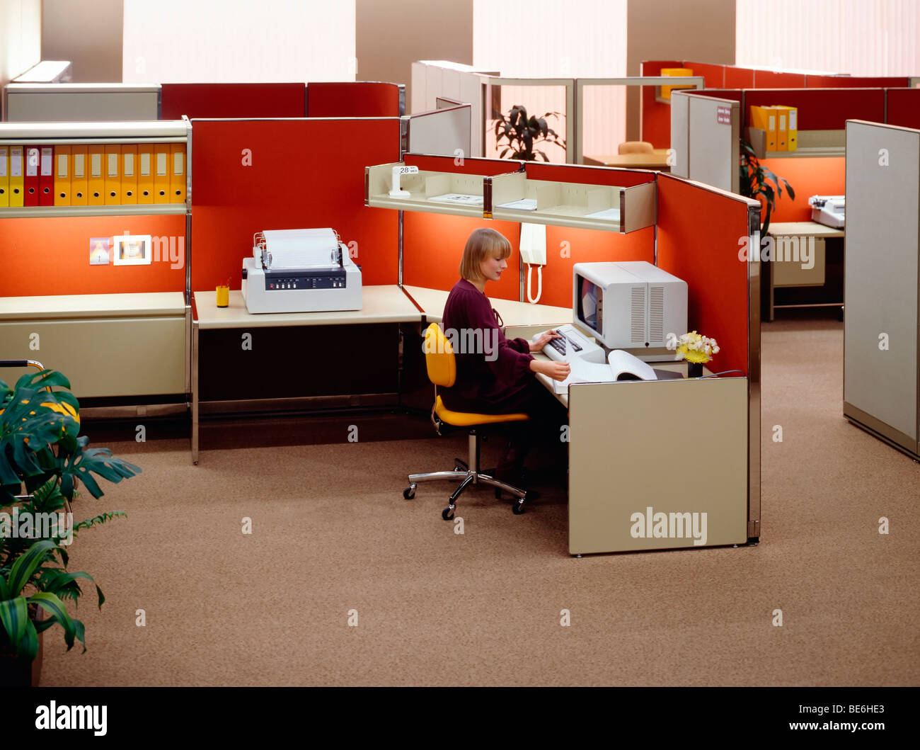 1980s open space office with woman at computer France Europe Stock Photo