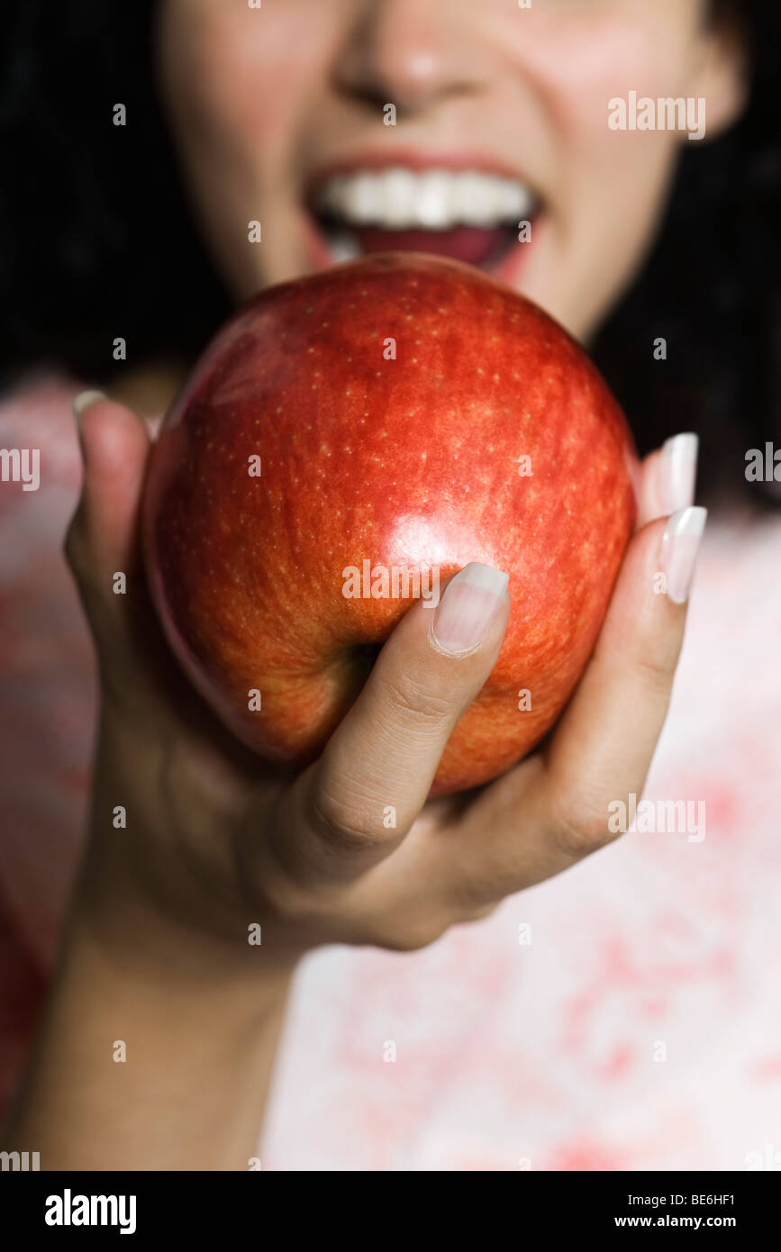 Woman eating apple, cropped Stock Photo