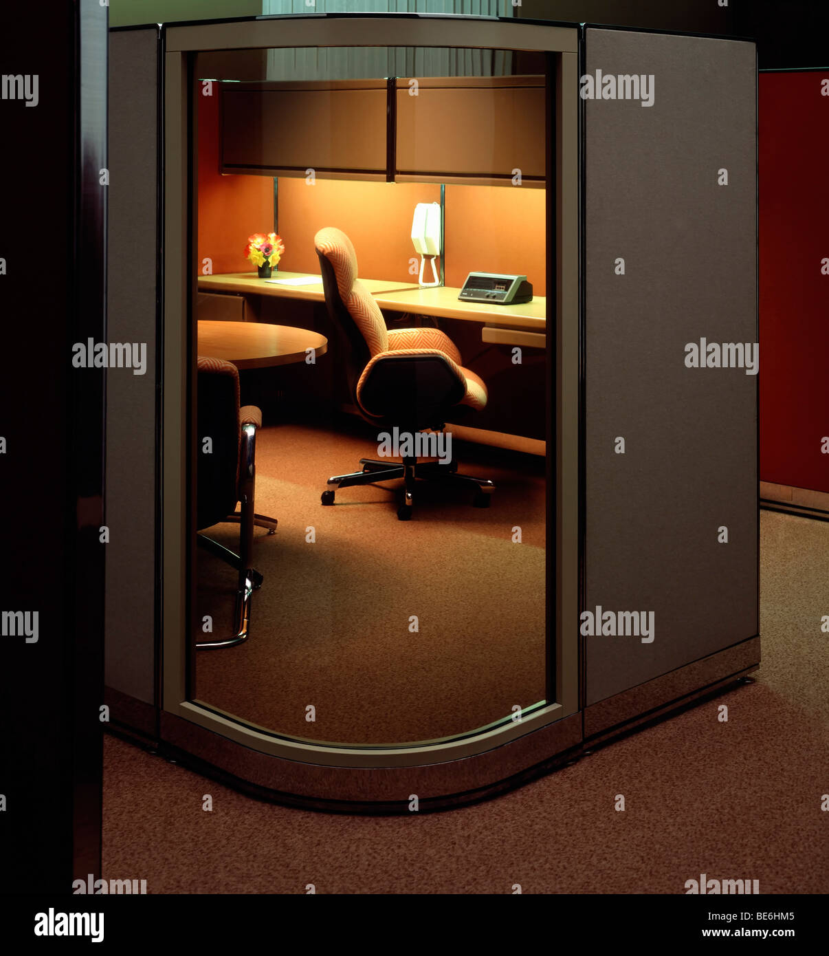 1980s office with partition glass wall at night Stock Photo