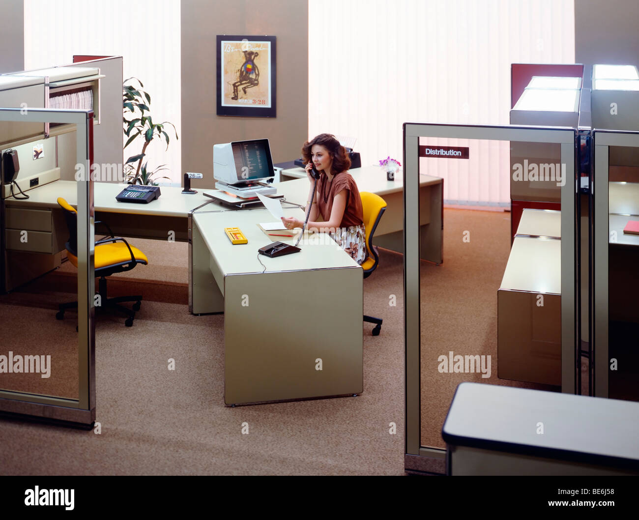 1980s open space office with woman at telephone France Europe Stock Photo