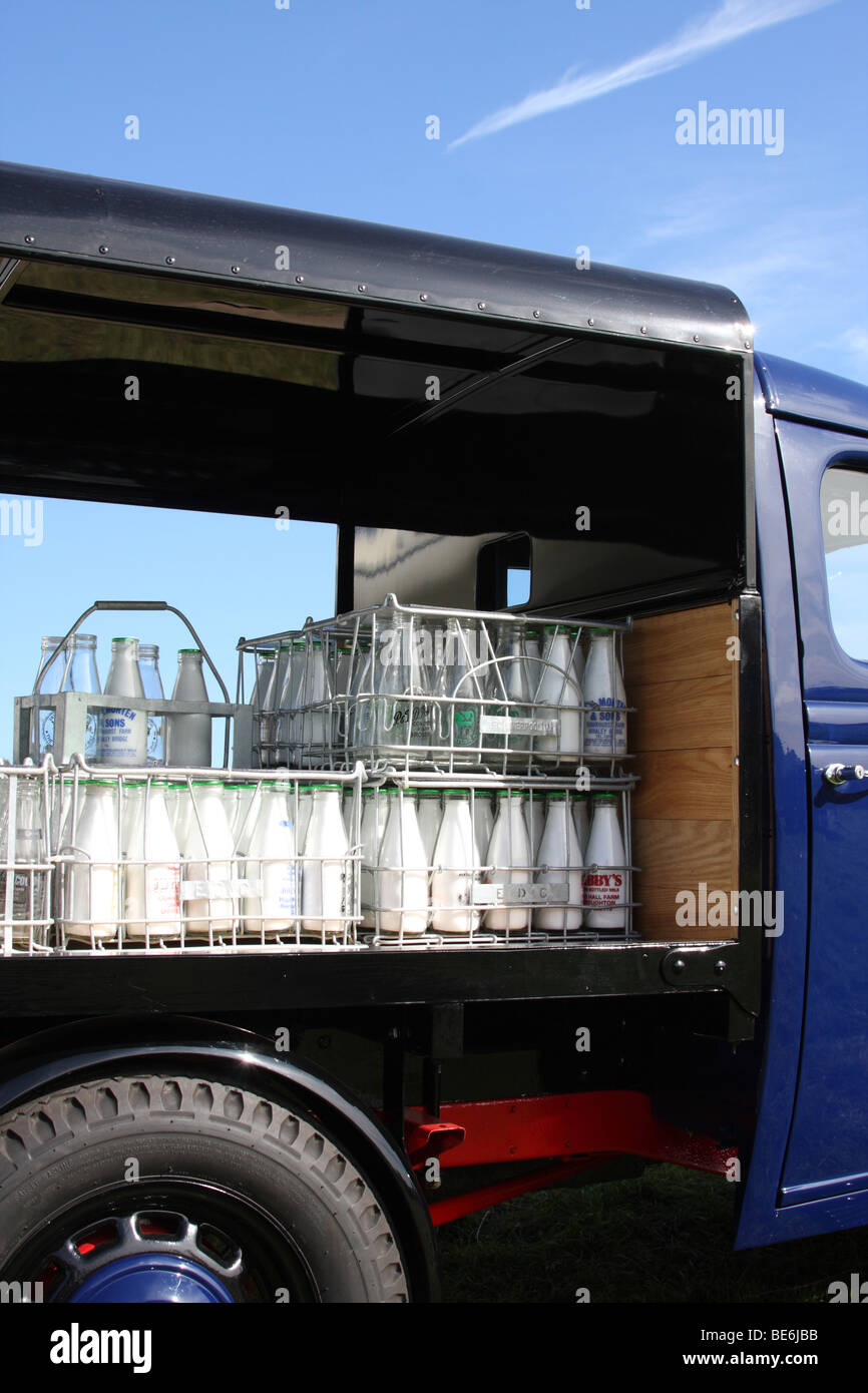 Milk bottles on an old milk float in the U.K Stock Photo Alamy