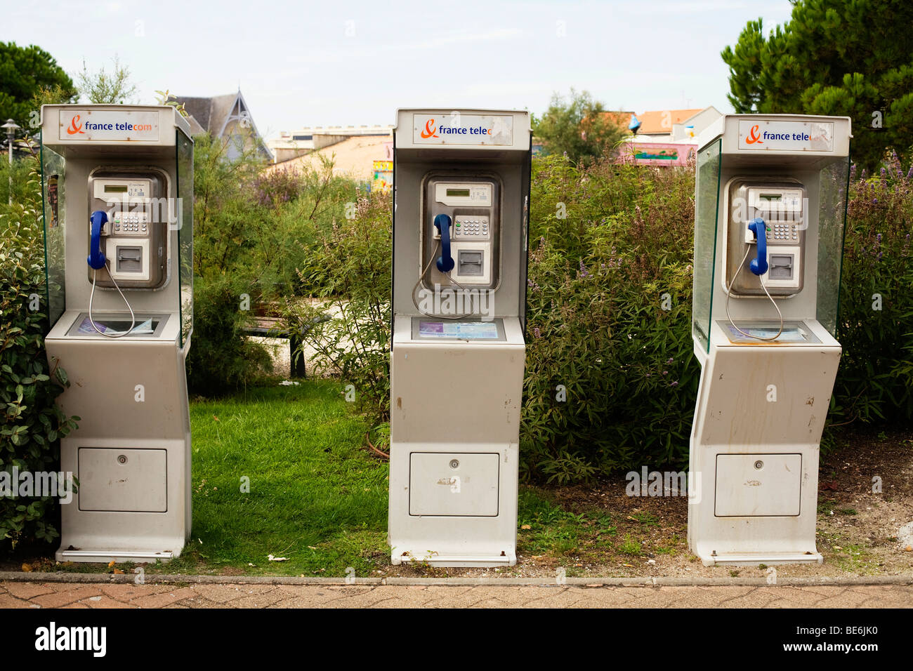France Telecom public phone boxes in the holiday resort town of Lacanau Ocean on the Atlantic south west coast of France Stock Photo