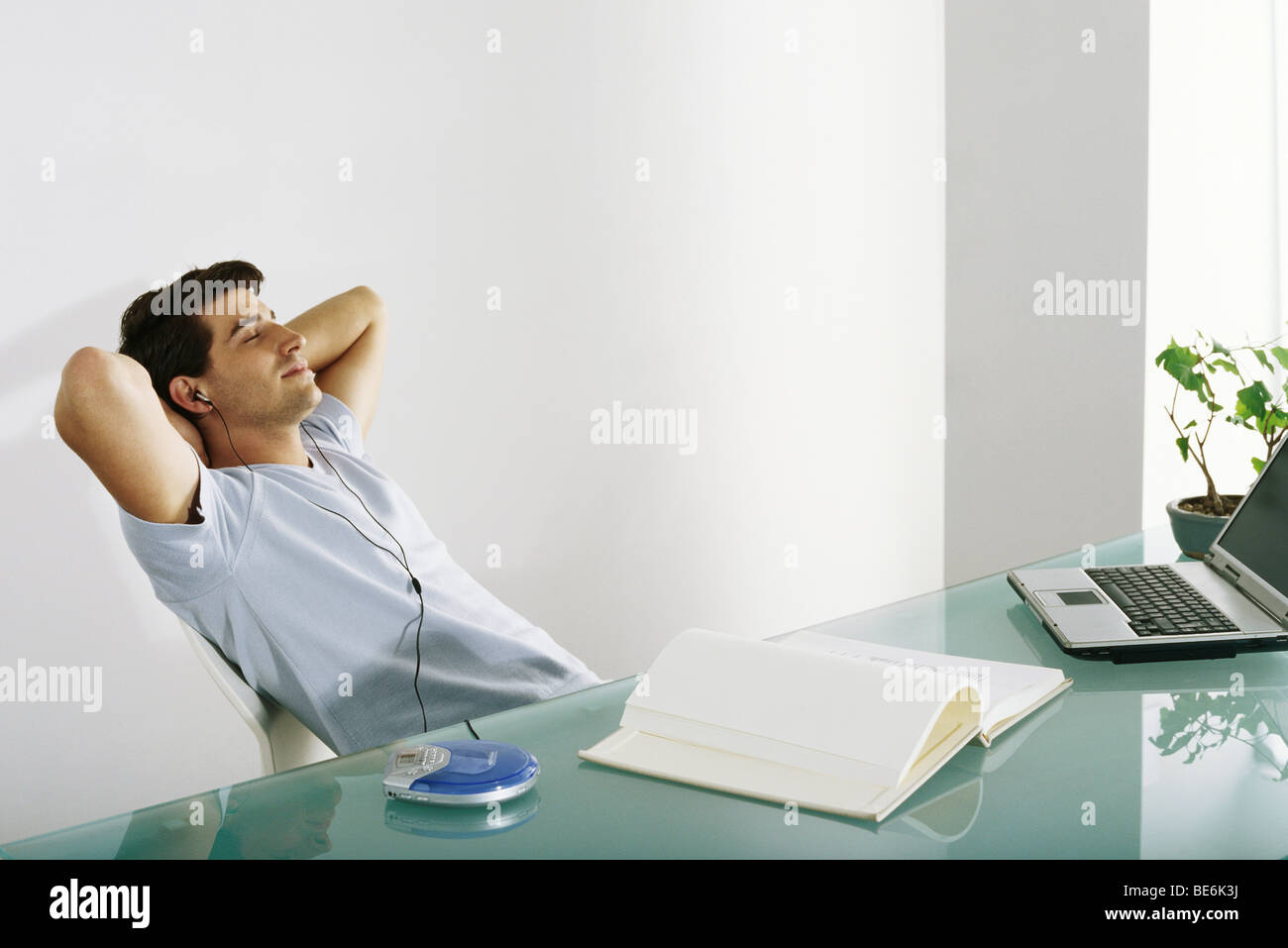 Man desk leaning back hands hi-res stock photography and images - Alamy