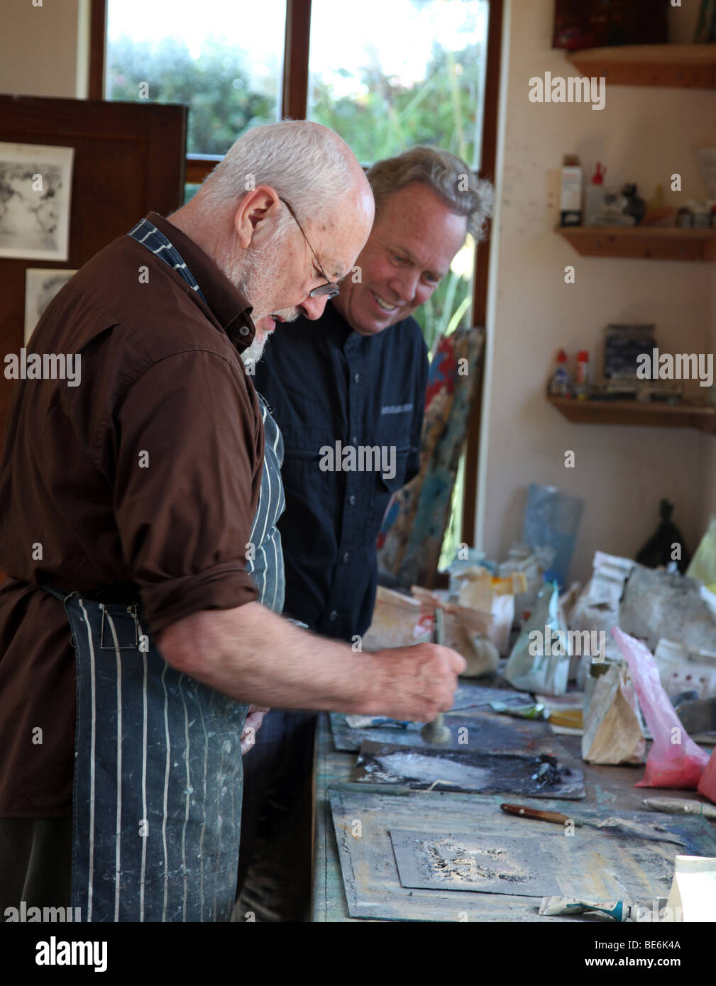 Artist John Kingerlee and Dr Ted Pillsbury in his studio, Beara Peninsula, Ireland Stock Photo
