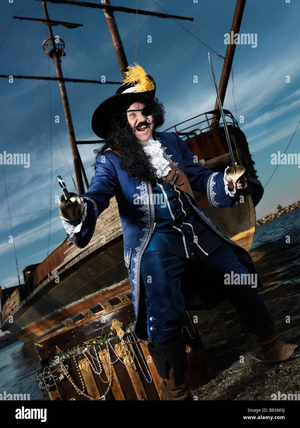 License available at MaximImages.com - Pirate ashore with a treasure chest Stock Photo