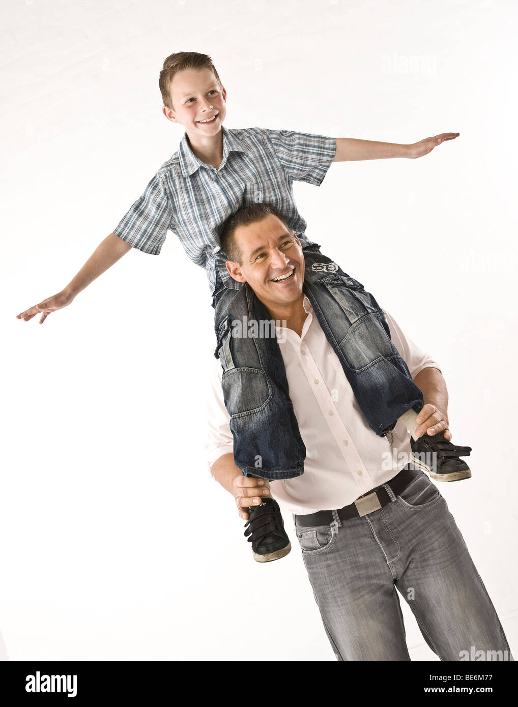 Father carrying his son on his shoulders Stock Photo - Alamy