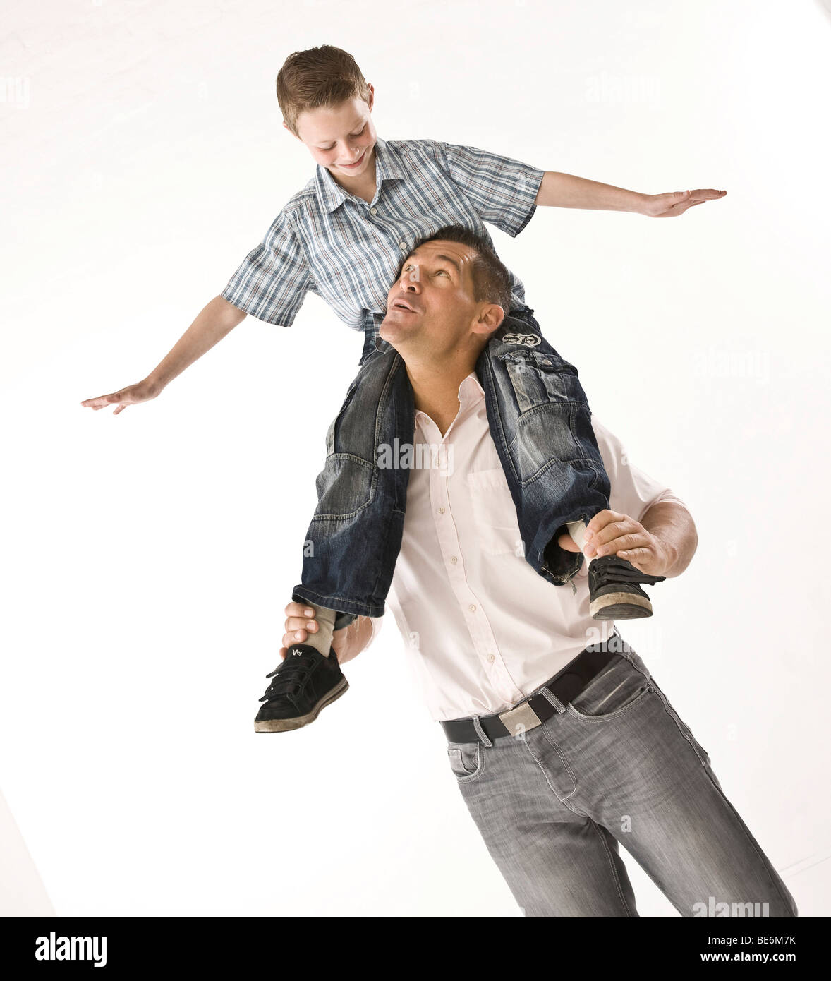Father carrying his son on his shoulders Stock Photo - Alamy