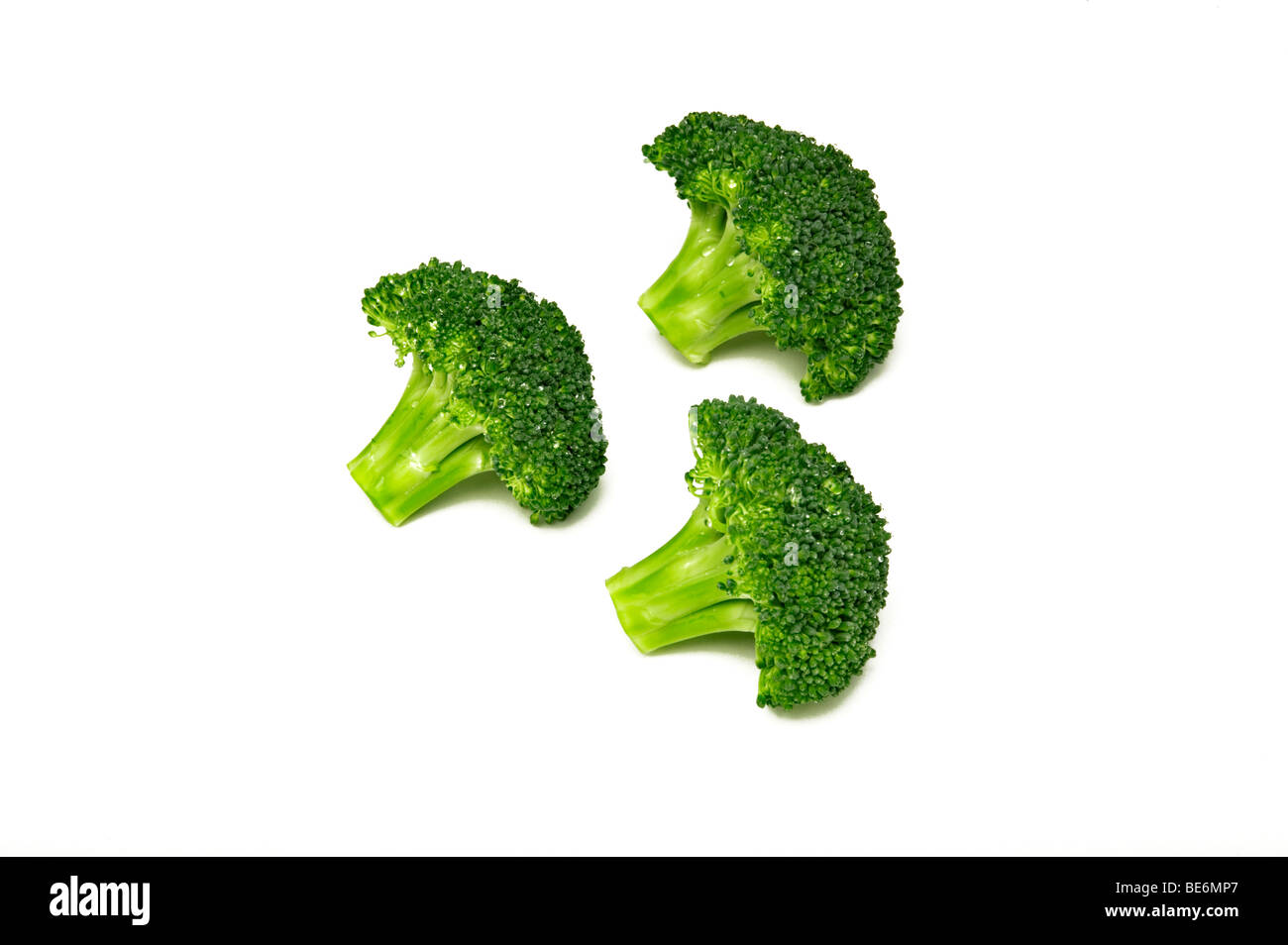 Three heads of broccoli Stock Photo Alamy