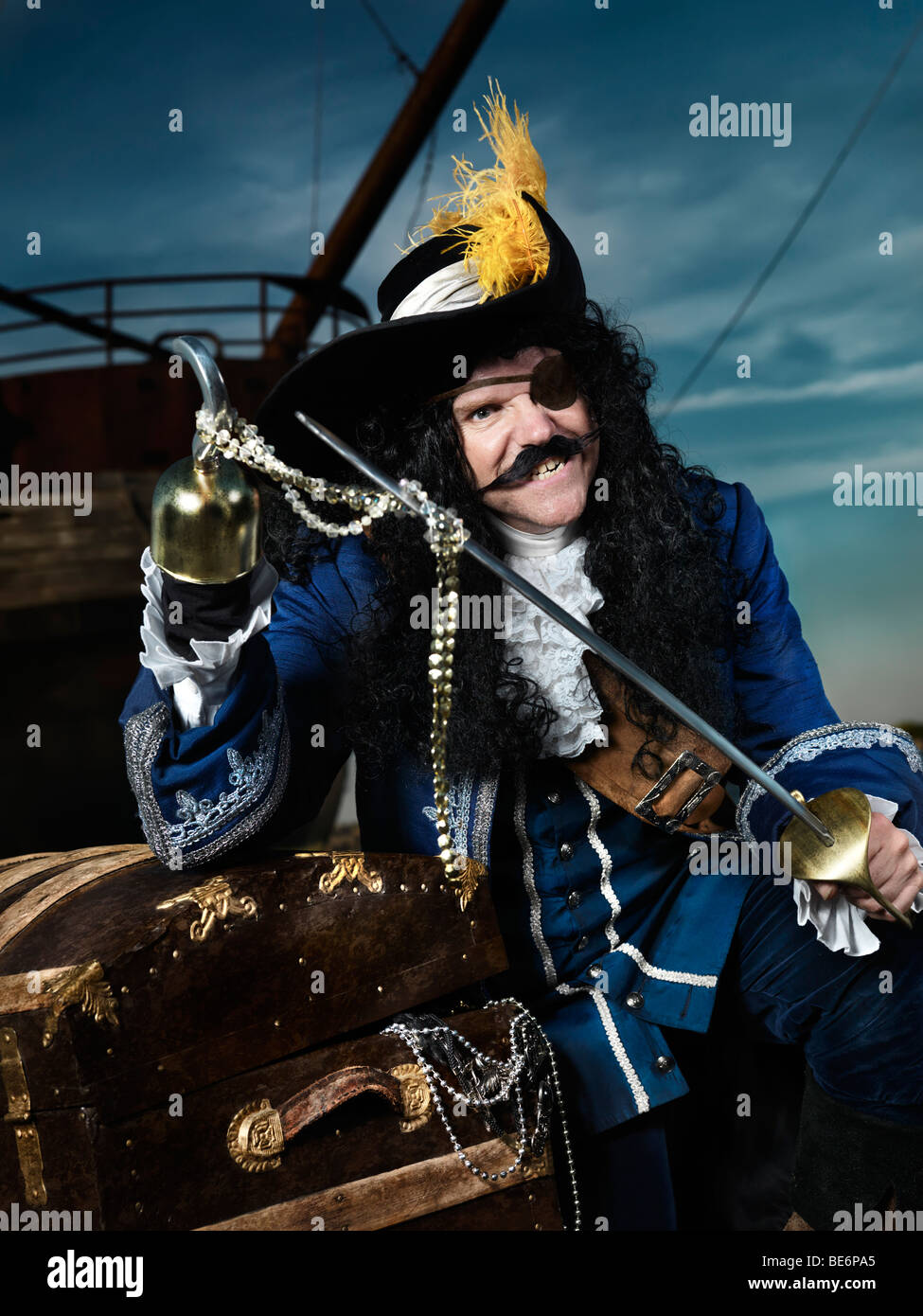 License available at MaximImages.com - Pirate opening a treasure chest Stock Photo