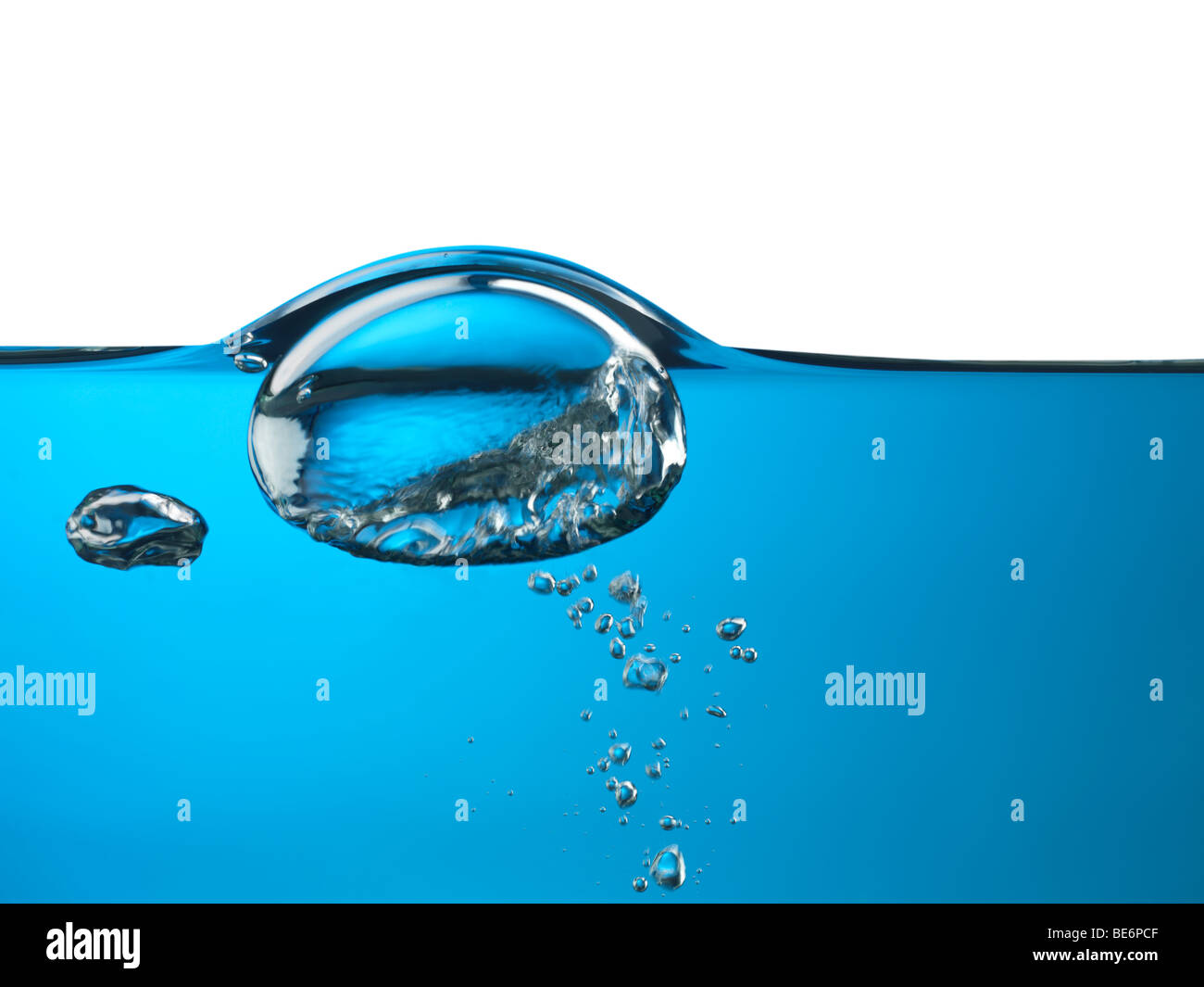 Oxygen bubble rising to the surface of water isolated on white background Stock Photo