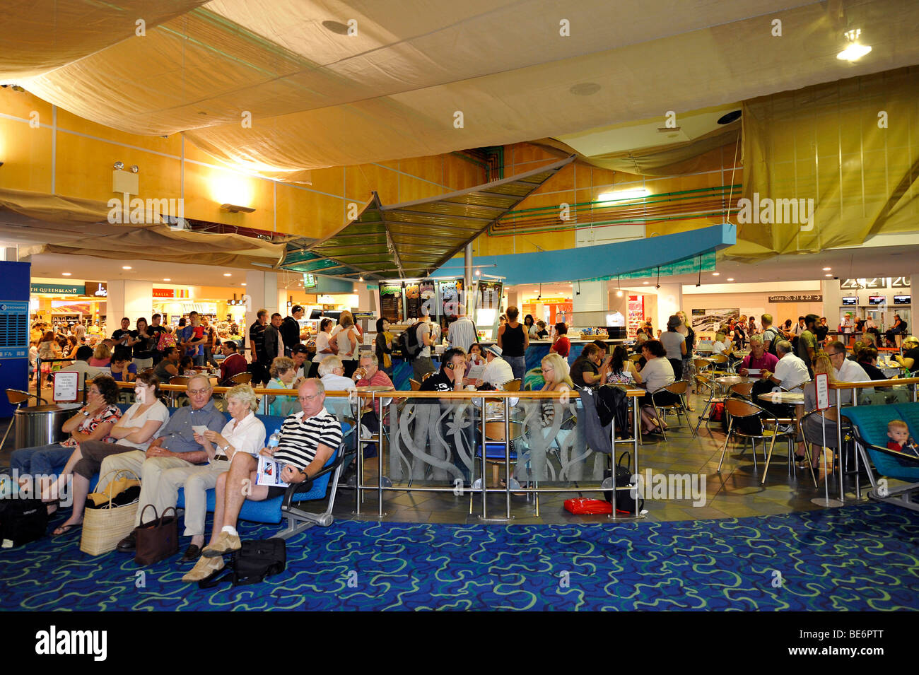 Stores and passengers at an airport gate, waiting area, Brisbane International Airport, Brisbane, Queensland, Australia Stock Photo