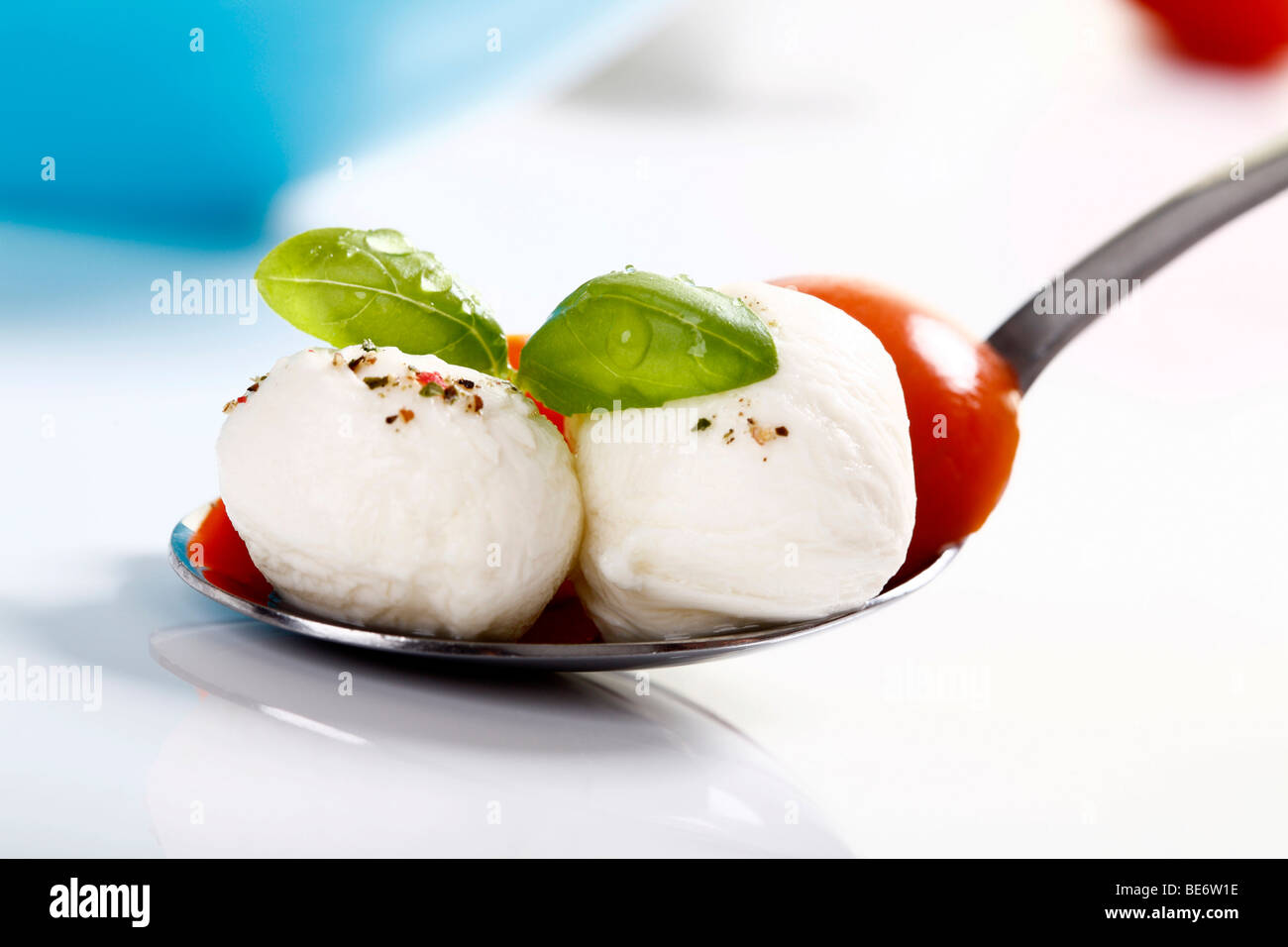 Mozzarella balls with tomatoes and basil Stock Photo