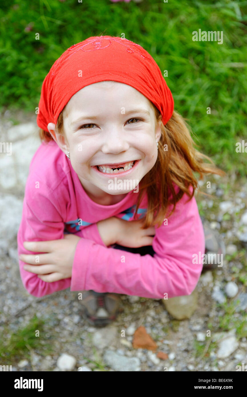 Little girl with a tooth gap, top incisor teeth are missing Stock Photo
