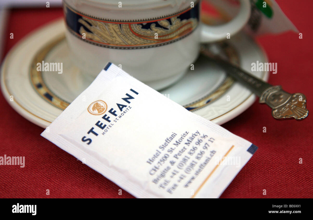 cup of coffee and sugar sachet in st moritz switzerland Stock Photo Alamy
